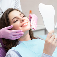 a patient visiting their cosmetic dentist in Carlisle