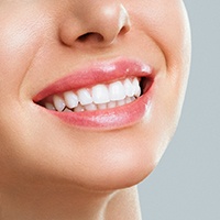 A smiling person who received teeth whitening in Carlisle