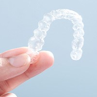 Patient holding clear aligner