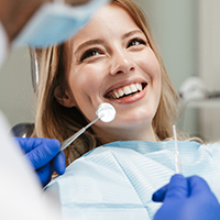 Woman smiling while visiting Carlisle dentist