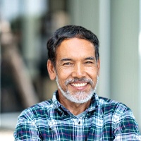 Man smiling with dental bridge in Carlisle