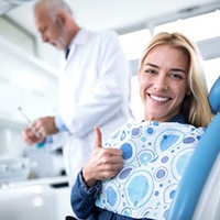 A patient giving a thumbs up before her root canal in Carlisle, PA