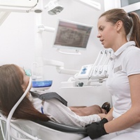 dentist talking to patient under sedation 