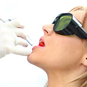 woman having teeth lasered