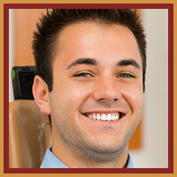 man in light blue shirt smiling