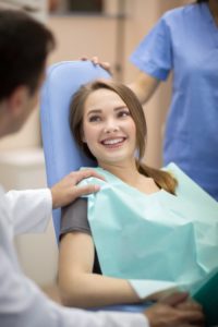 A woman at her dental office.