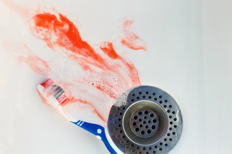 toothbrush and blood in sink