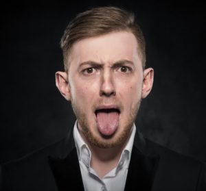 man sticking out tongue