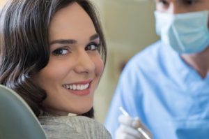 woman smiling dentist chair