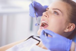 person getting their teeth checked by dentist