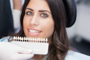 woman getting veneers from her dentist