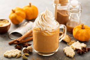 Seasonal hot drinks surrounded by other fall treats