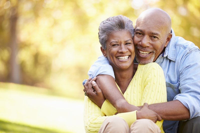 senior couple smiling outdoors