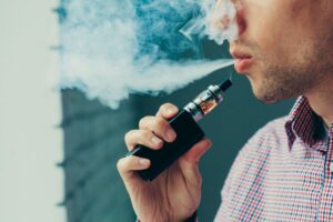 closeup of a man vaping